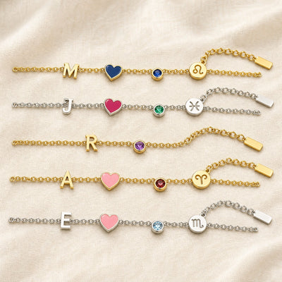Five personalized charm bracelets in gold and silver with different initials, hearts, birthstones and zodiac signs