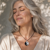 Mature woman wearing the Yin Yang balance necklace