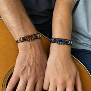 Father and son wearing the red and blue guitar bracelets