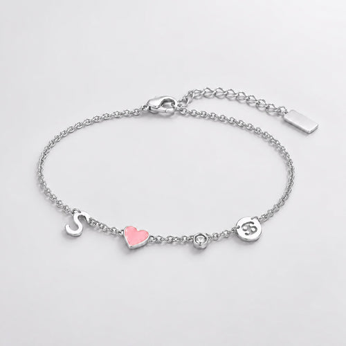 Silver charm bracelet with initial, heart, birthstone and zodiac coin