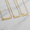 Custom Name Necklace - three personalized gold name pendants on marble