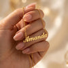 Custom Name Necklace - hand holding gold cursive name pendant