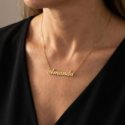 Custom Name Necklace - woman wearing personalized gold cursive name pendant