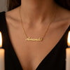 Custom Name Necklace - gold name pendant on black evening dress candlelight