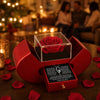 Open red heart rose box with the necklace and message card
