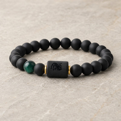 Zodiac bracelet with matte black beads and engraved sign block